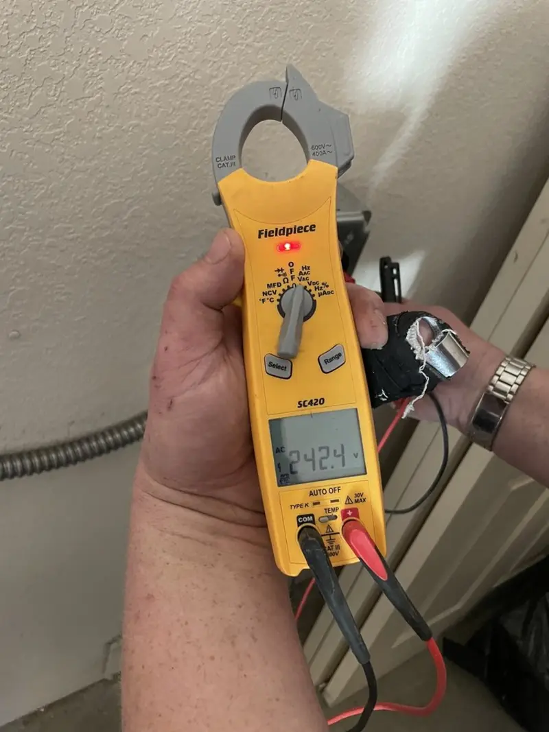 Voltage testing with clamp meter during Electrical Installation Services in Miami Lakes
